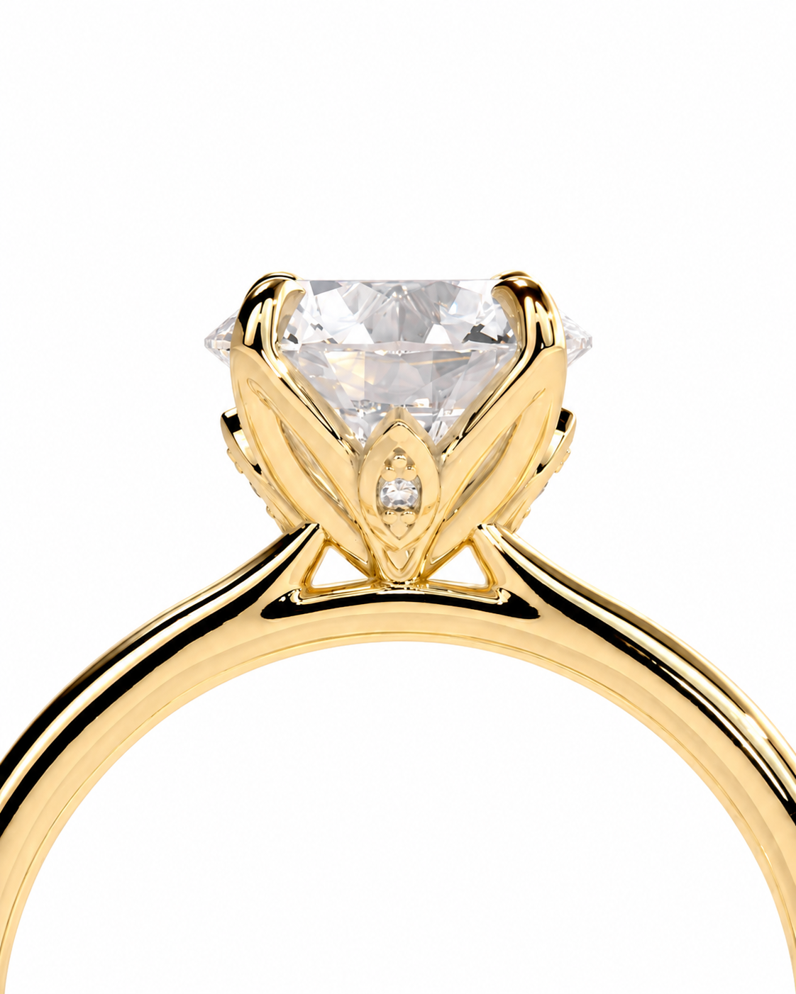 color_10K_YG, color_14K_YG &&A close-up of a yellow gold solitaire engagement ring featuring a large clear round-cut center stone and a small accent stone in the crown, set against a plain white background.