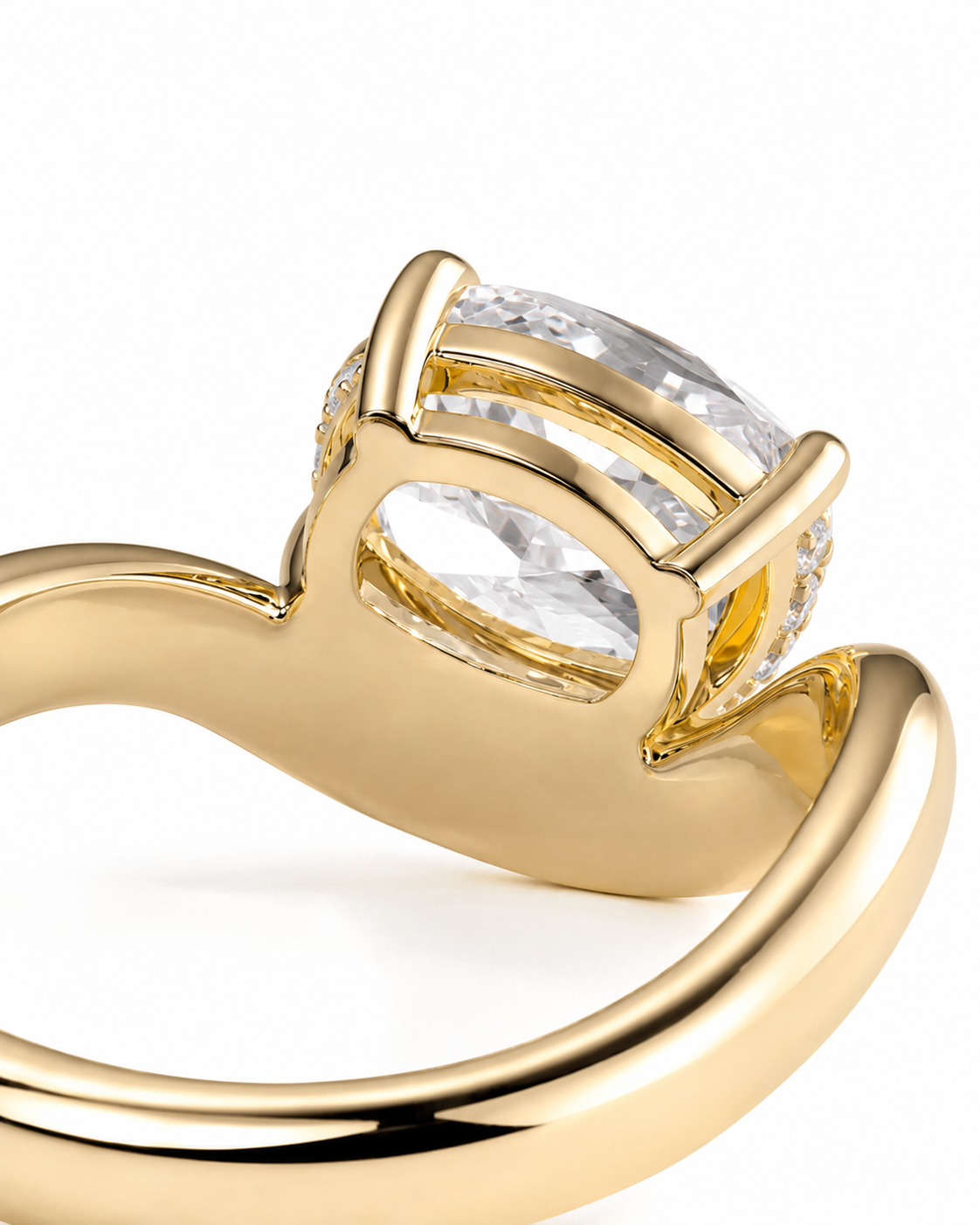 color_10K_YG, color_14K_YG &&A close-up of a yellow gold ring featuring a large clear marquise-cut center stone and smaller side stones in a prong setting, shown on a white background.