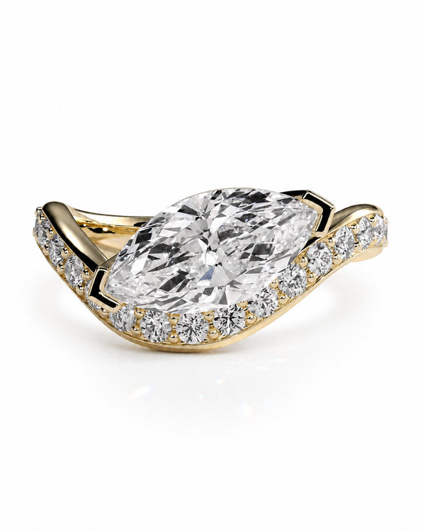 color_10K_YG, color_14K_YG &&A yellow gold ring featuring a large marquise-cut clear center stone, surrounded by a halo of small round stones on a curved shank, shown on a white background.