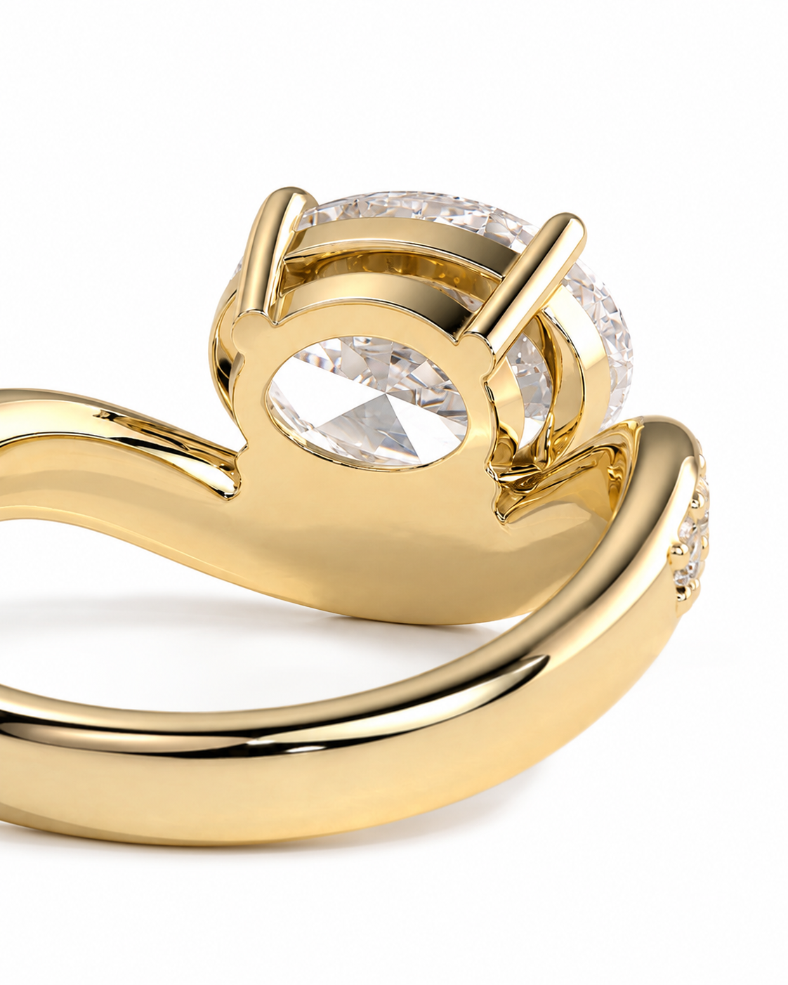 color_10K_YG, color_14K_YG &&A close-up shot of a gold ring featuring a large oval clear gemstone in a prong setting, with a smaller round clear gemstone in a channel setting on the band, against a white background.
