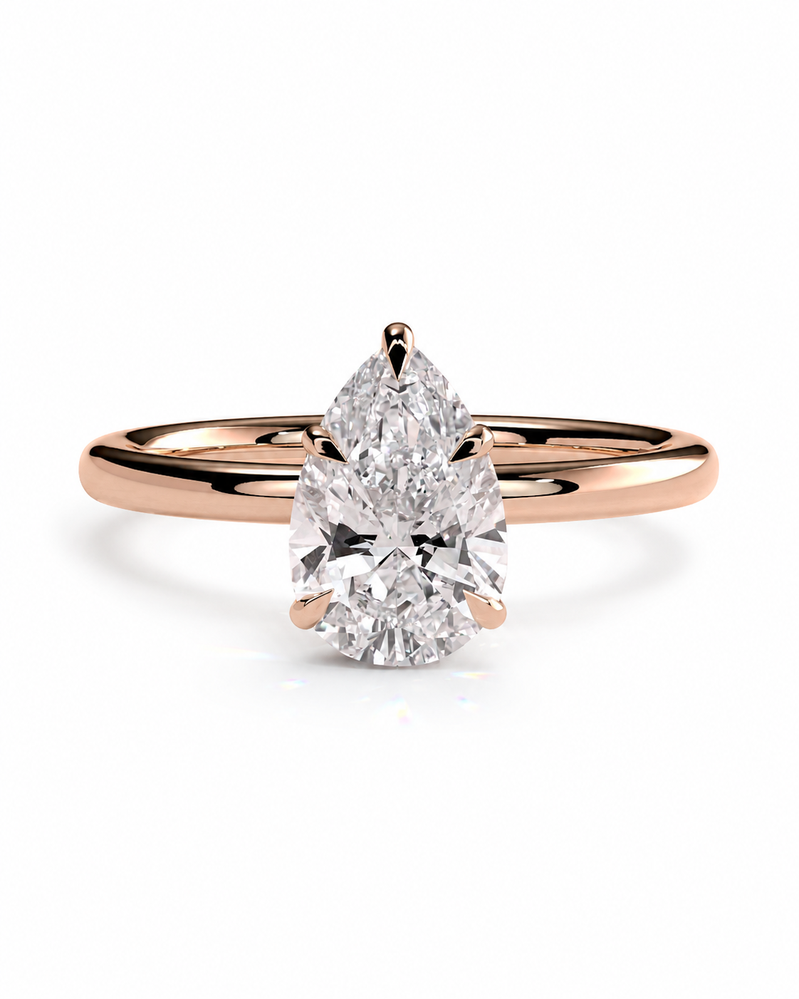color_10K_RG, color_14K_RG &&
A pear-cut diamond solitaire engagement ring in a rose gold band, shown on a clean white background.
