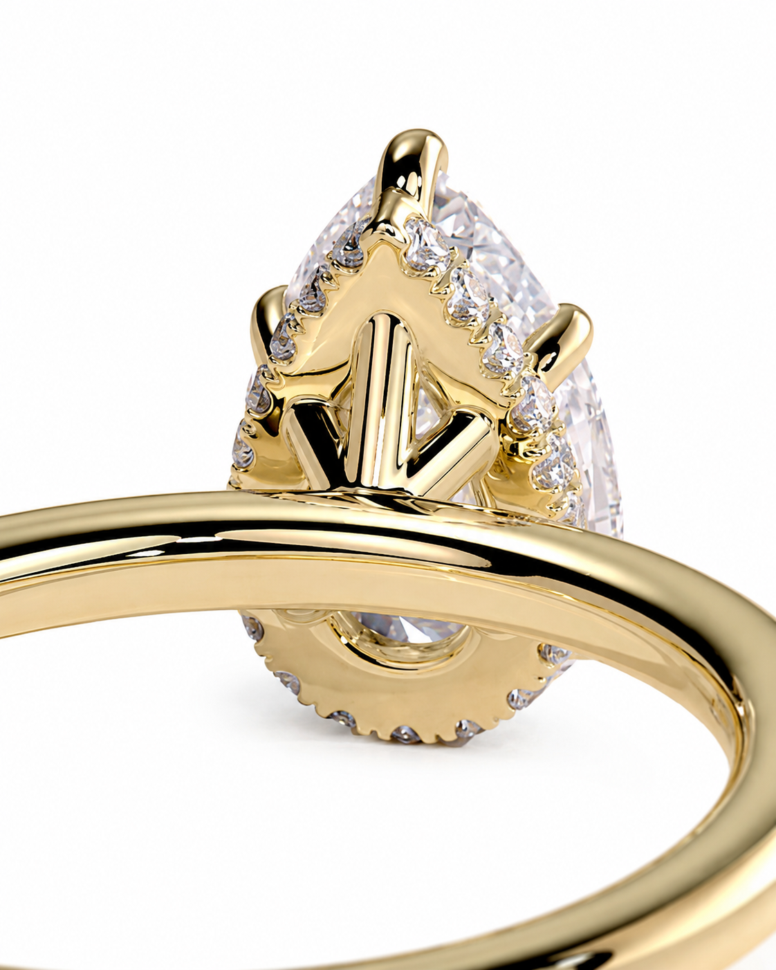 color_10K_YG, color_14K_YG &&
Close-up of a gold ring featuring a teardrop-shaped clear gemstone in a crown-like prong setting with small accent stones, shown on a white background.