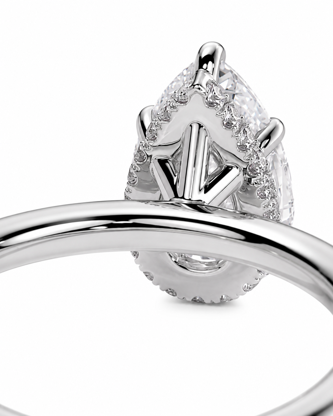 color_925_SIL,color_935_ARG,color_10K_WG, color_14K_WG &&
A close-up of a silver-toned ring featuring a teardrop-shaped marquise-cut diamond surrounded by smaller round diamonds, with a polished band in the foreground against a white background.