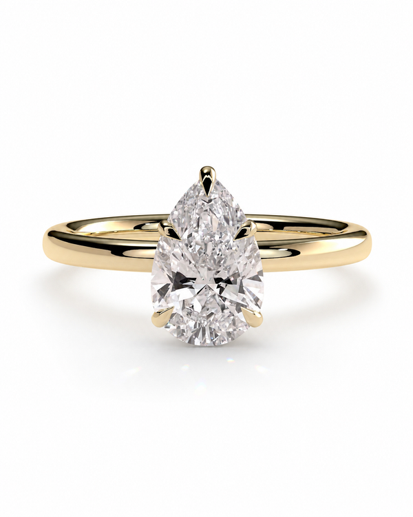 color_10K_YG, color_14K_YG &&
A pear-cut diamond engagement ring with a yellow gold band, shown on a clean white background.
