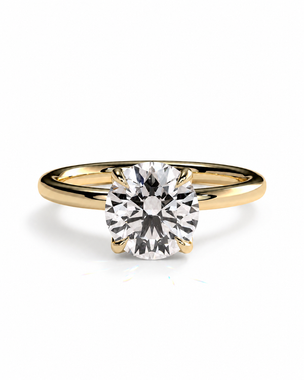 color_10K_YG, color_14K_YG &&A classic solitaire engagement ring featuring a round brilliant-cut diamond set in a yellow gold four-prong band, shown on a clean white background.