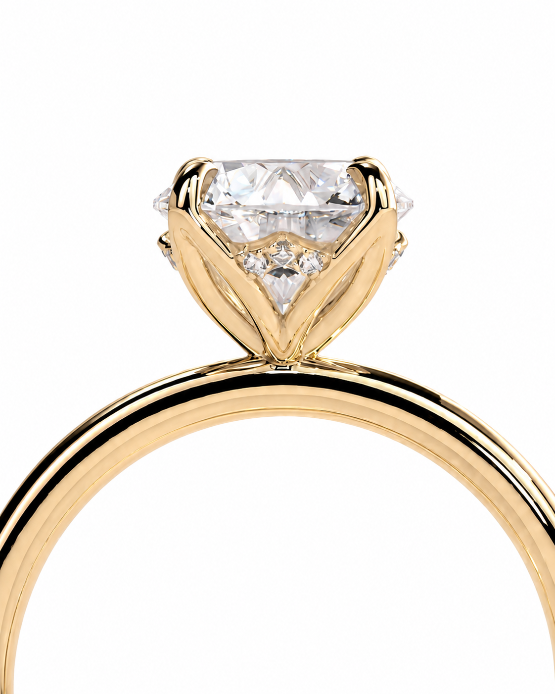 color_10K_YG, color_14K_YG &&A close-up of a yellow gold solitaire engagement ring with a large clear round-cut diamond and smaller accent diamonds, shown on a plain white background.