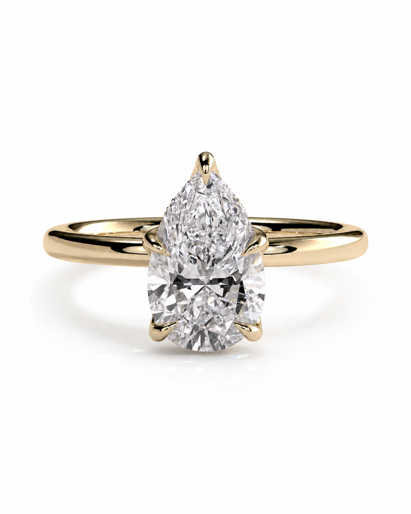 color_10K_YG, color_14K_YG &&A pear-cut diamond engagement ring with a yellow gold band, shown on a clean white background.