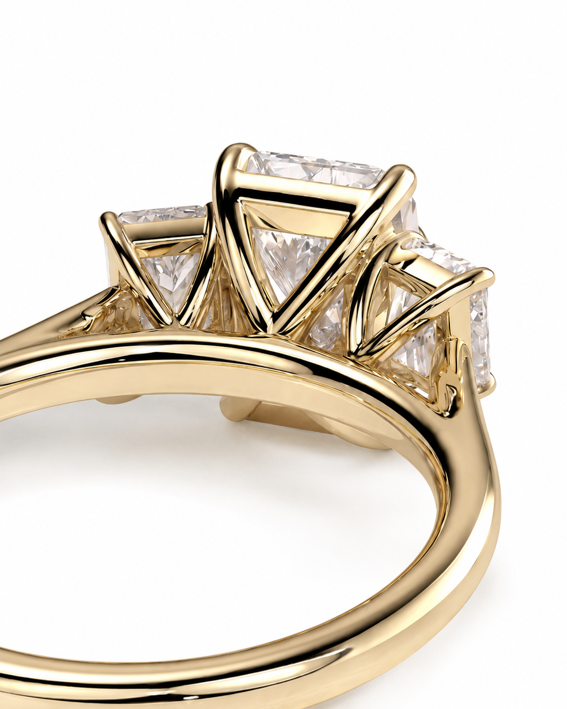 color_10K_YG, color_14K_YG &&A close-up of a yellow gold ring featuring a geometric cluster of clear baguette and round-cut stones, set against a plain white background.
