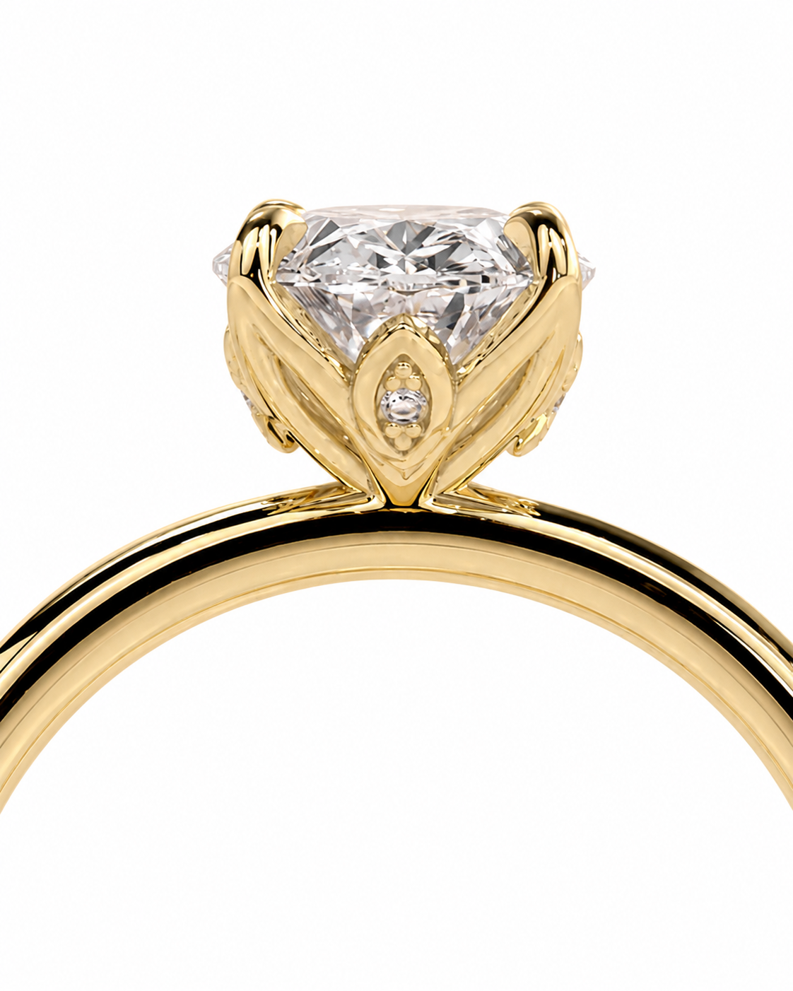 color_10K_YG, color_14K_YG &&A close-up shot of a yellow gold solitaire engagement ring with a cushion-cut diamond center stone and a small accent diamond, set against a plain white background.