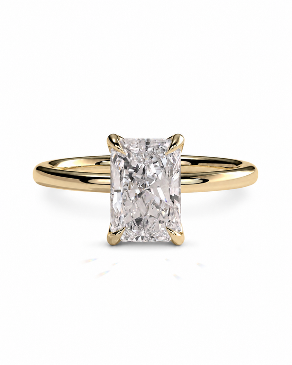 color_10K_YG, color_14K_YG &&A yellow gold engagement ring featuring a large rectangular radiant-cut diamond center stone in a four-prong setting, shown on a clean white background.