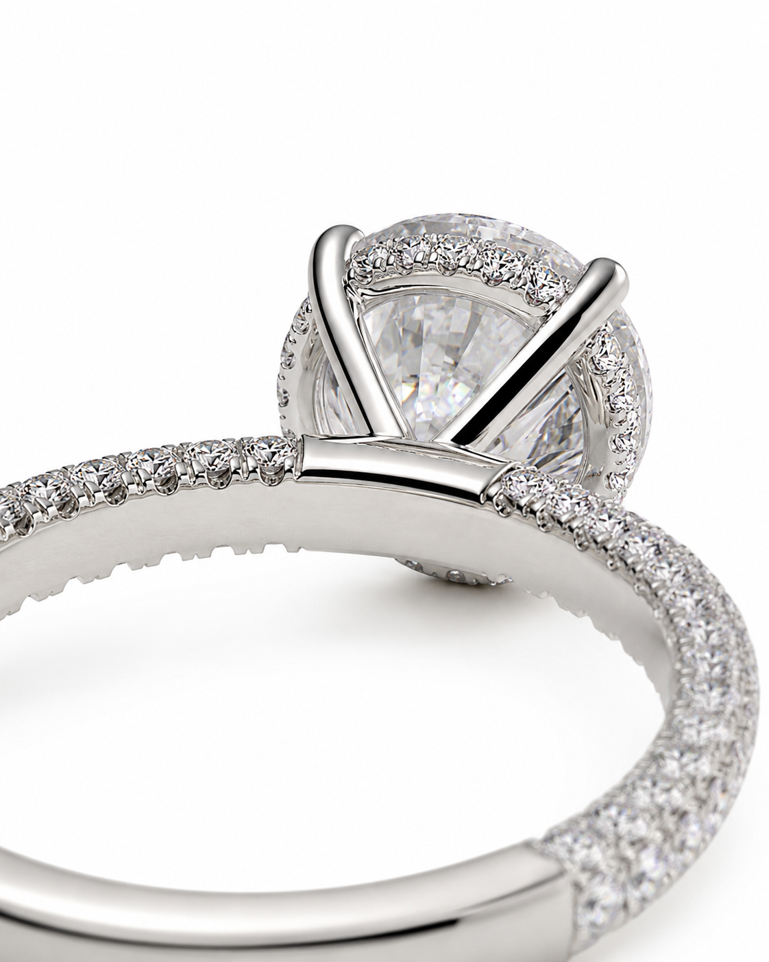 color_925_SIL,color_935_ARG,color_10K_WG, color_14K_WG &&
A close-up studio shot of a silver-toned diamond ring featuring a large round-cut center stone in a prong setting, surrounded by a halo of small pave diamonds on a white background.