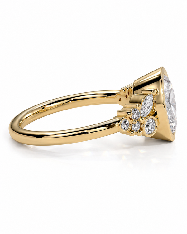 color_10K_YG, color_14K_YG &&A yellow gold diamond ring with a large marquise-cut center stone and smaller round and marquise-cut accent diamonds, shown on a clean white background.