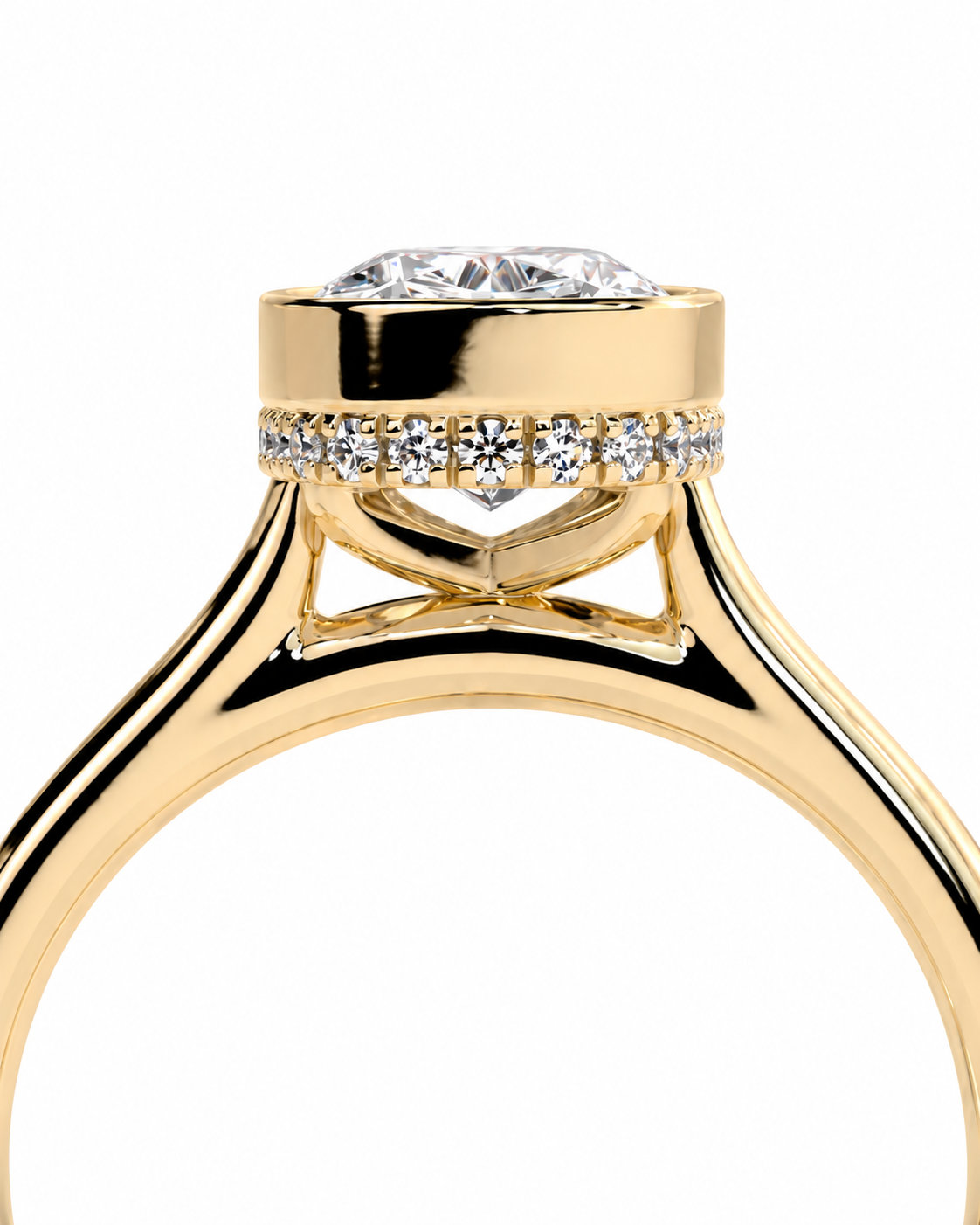 color_10K_YG, color_14K_YG &&A close-up of a yellow gold ring with a brilliant round-cut diamond center stone and a halo of small pavé-set diamonds on the band, shown against a plain white background.