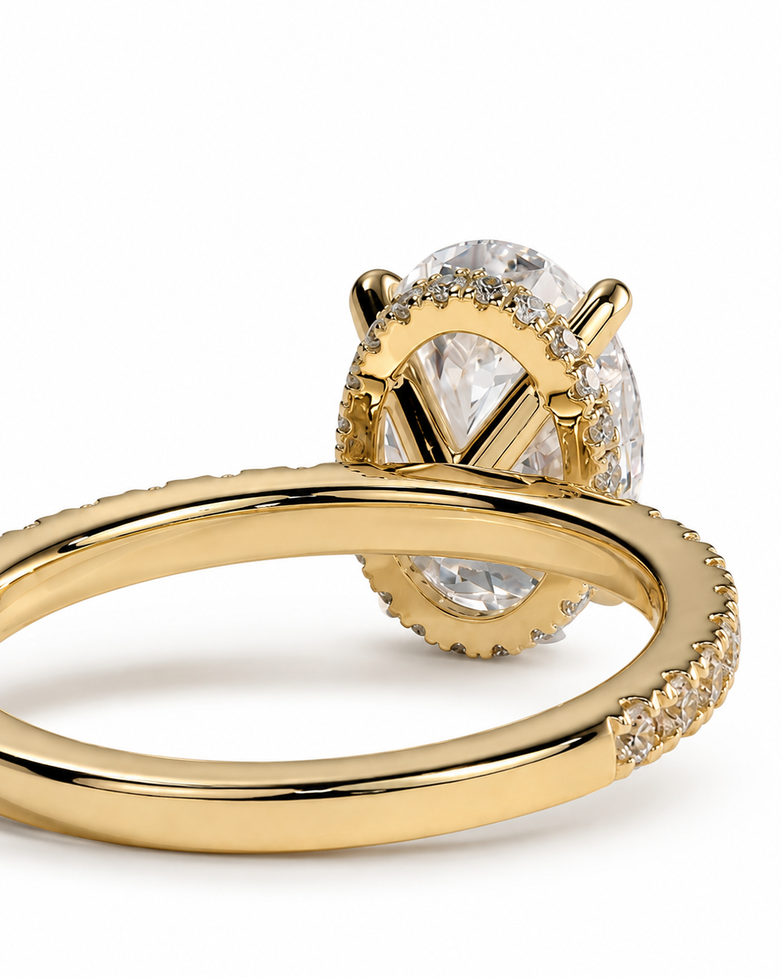 color_10K_YG, color_14K_YG &&A close-up studio shot of a gold ring with a large oval clear gemstone and small accent stones along the band, set against a clean white background.