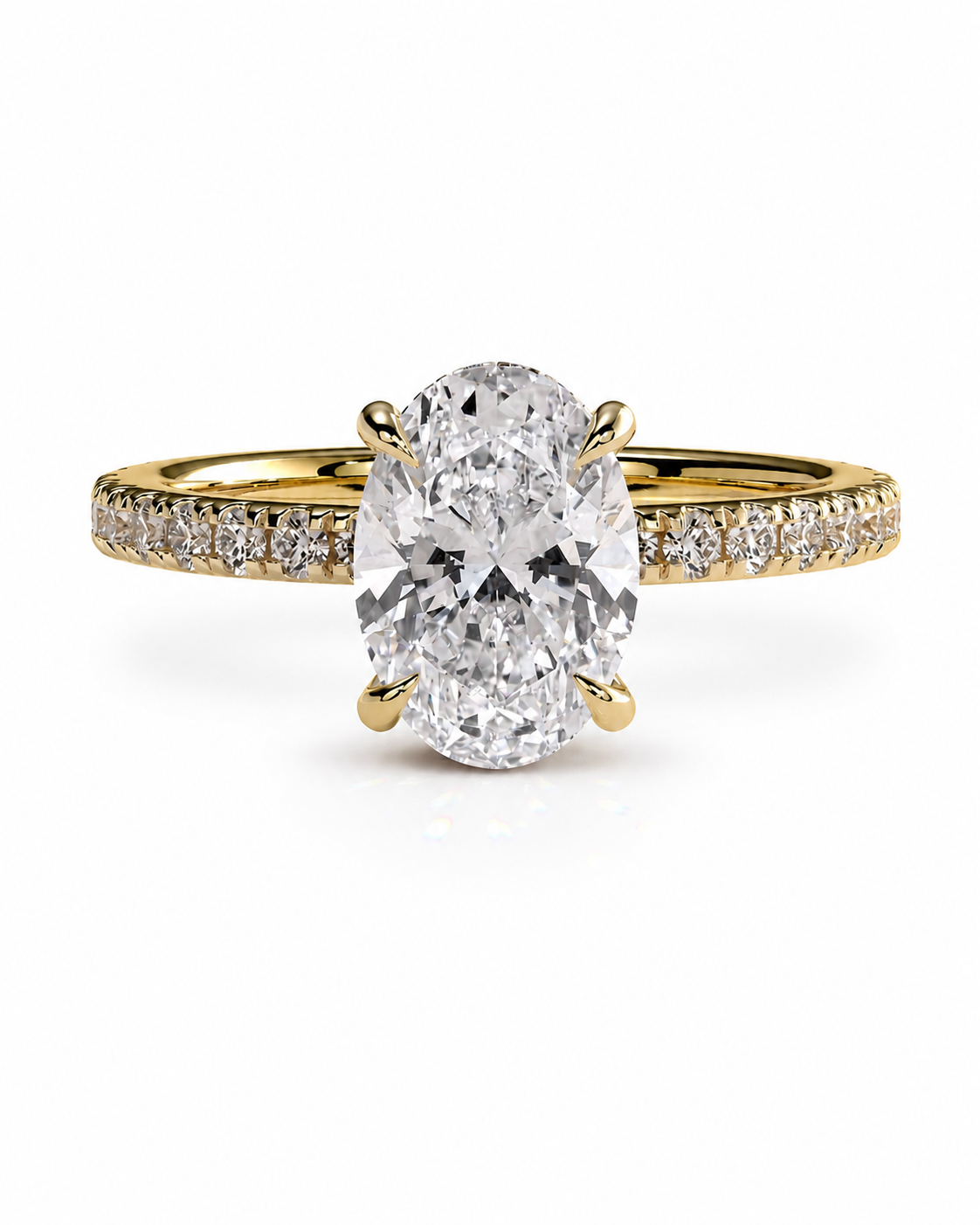 color_10K_YG, color_14K_YG &&An oval diamond engagement ring with a yellow gold band featuring pavé diamonds on the shoulders, set against a clean white background.
