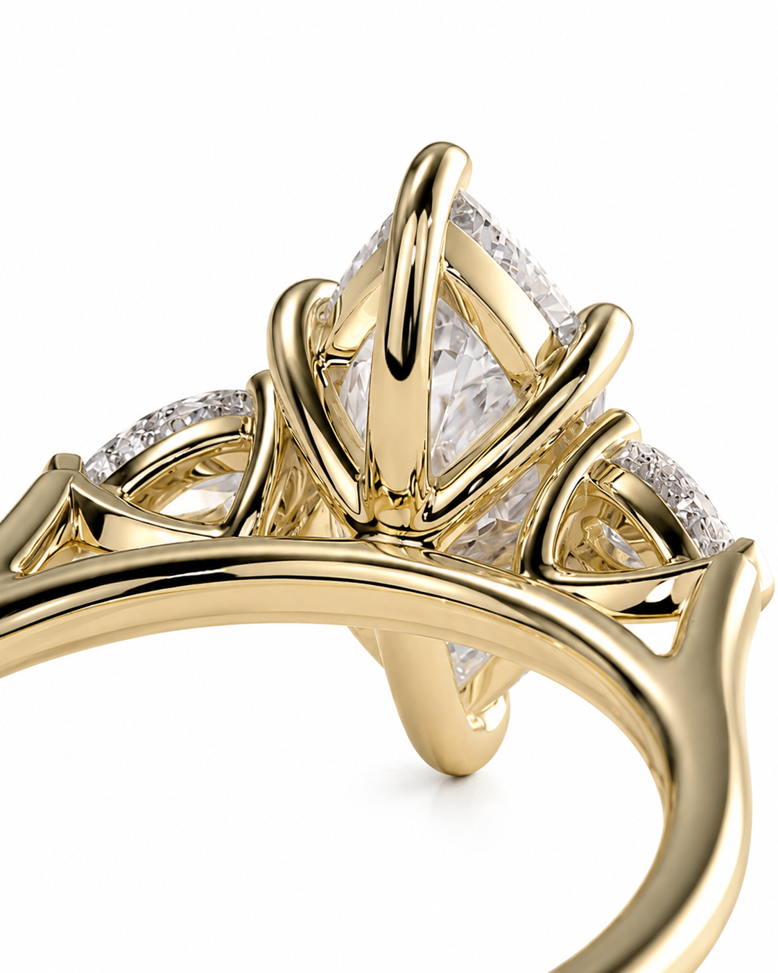 color_10K_YG, color_14K_YG &&A close-up of a yellow gold ring featuring a large triangular diamond center stone and smaller diamonds along the shoulders, set against a plain white background.