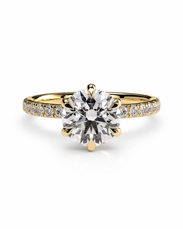color_10K_YG, color_14K_YG &&
A yellow gold solitaire engagement ring with a round brilliant-cut center stone and a pave band set with small round stones, shown on a clean white background.