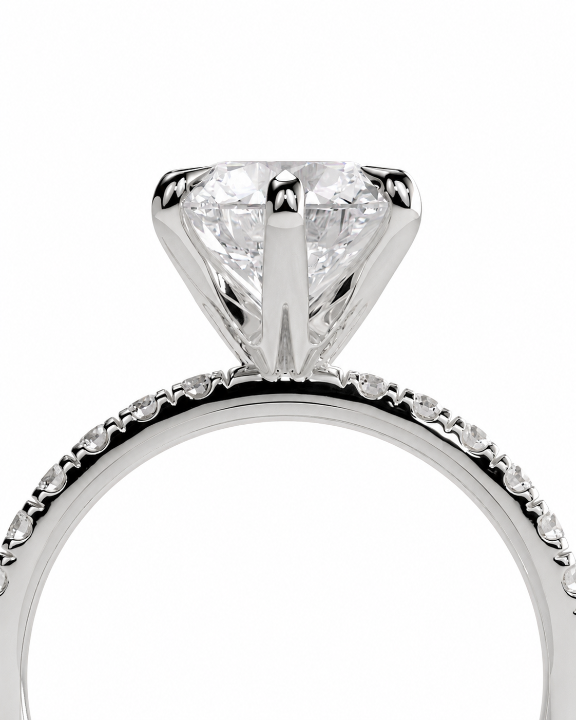 color_925_SIL,color_935_ARG,color_10K_WG, color_14K_WG &&
A close-up studio shot of a silver-toned solitaire engagement ring with a round brilliant-cut diamond and a micro-pave diamond band, set against a plain white background.