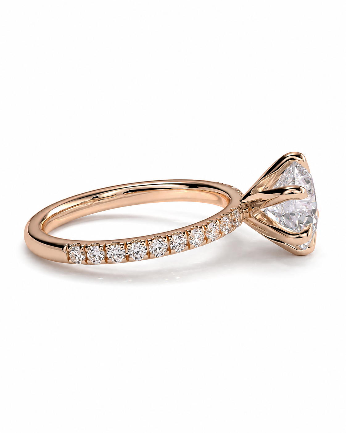 color_10K_RG, color_14K_RG &&
A rose gold engagement ring featuring a triangular-cut clear center stone in a prong setting, with a pave band of small round diamonds, shown on a white background.