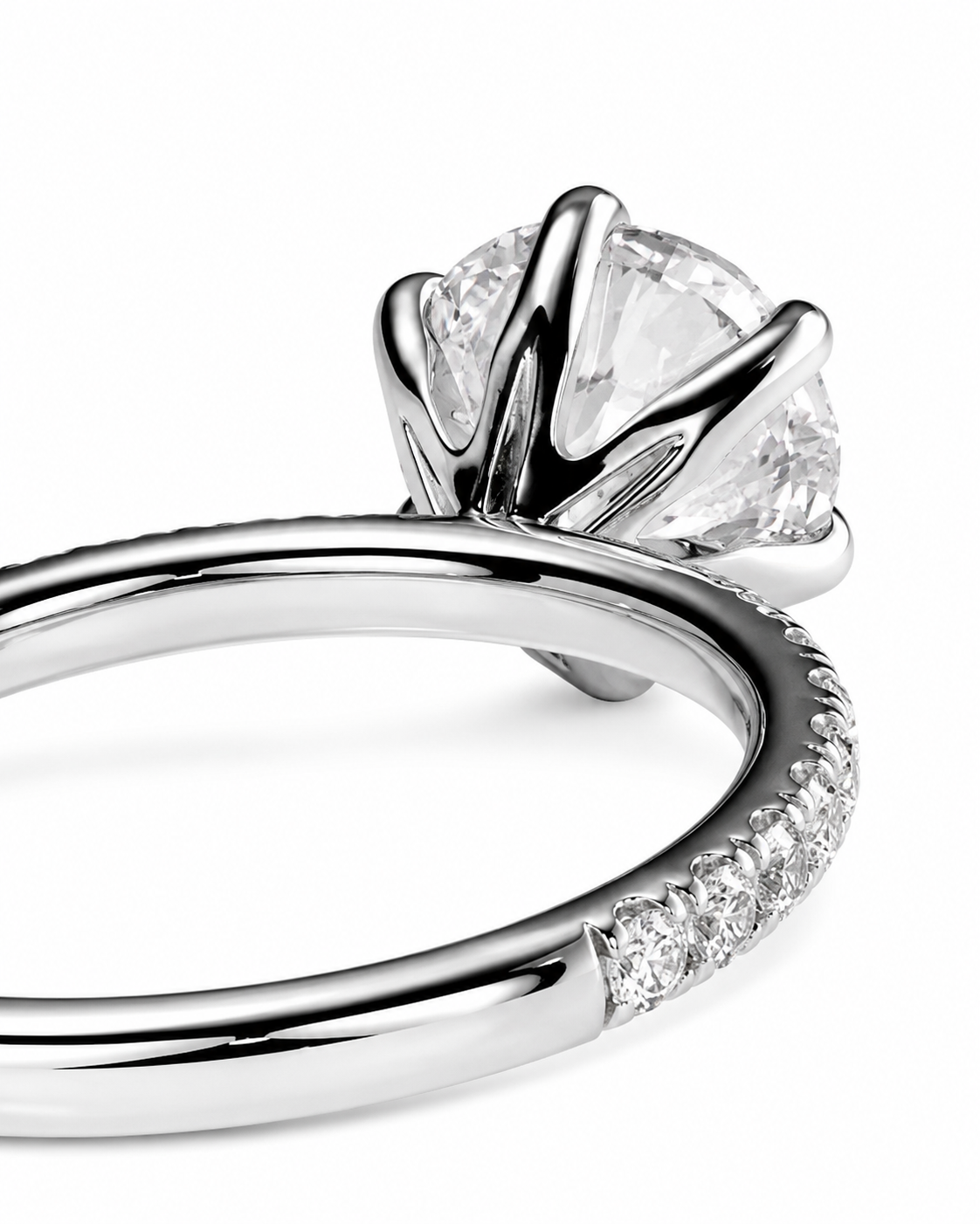 color_925_SIL,color_935_ARG,color_10K_WG, color_14K_WG &&
A close-up studio shot of a silver-toned ring with a large clear round gemstone in a prong setting and a pave band, photographed on a white background.