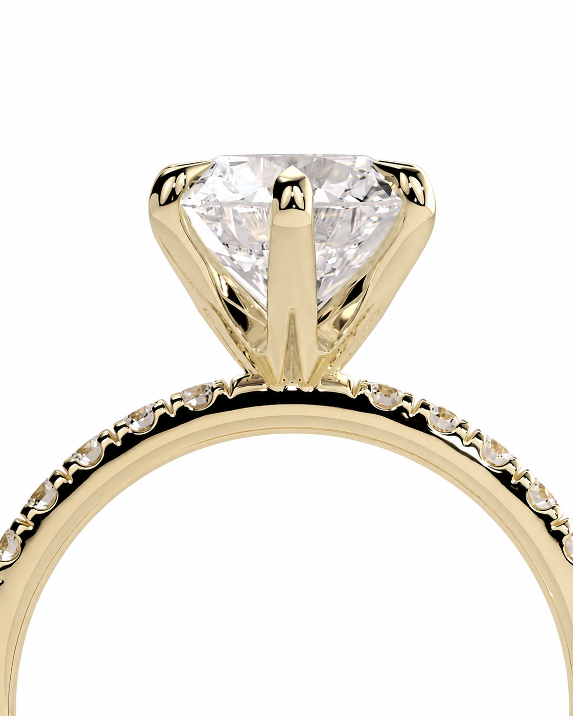 color_10K_YG, color_14K_YG &&
A close-up of a yellow gold solitaire engagement ring featuring a large round brilliant-cut diamond center stone and a halo of small pave-set diamonds along the band, set against a plain white background.