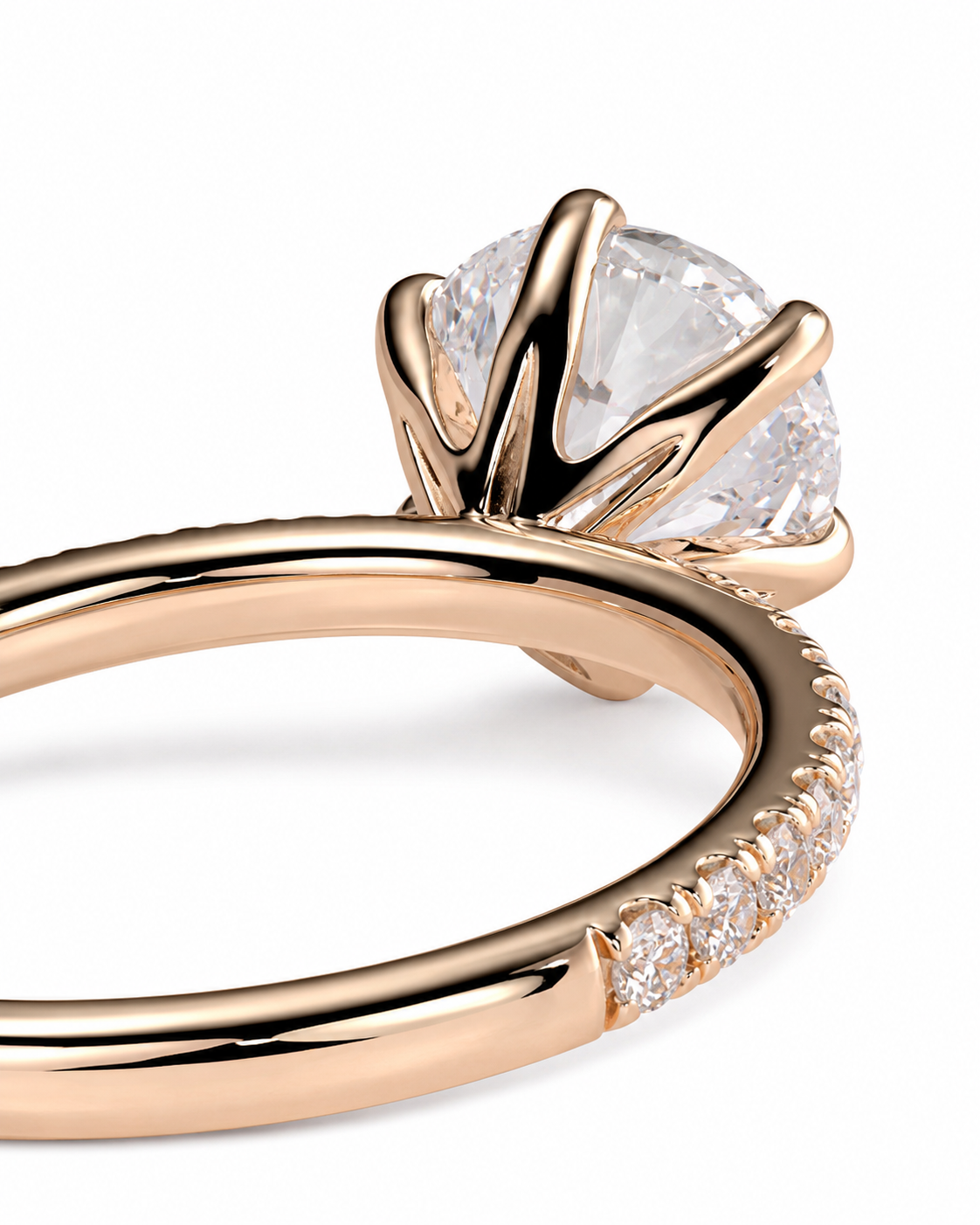 color_10K_RG, color_14K_RG &&
Rose gold engagement ring with a round brilliant-cut clear center stone and a pave band of small clear stones, shown on a white background.