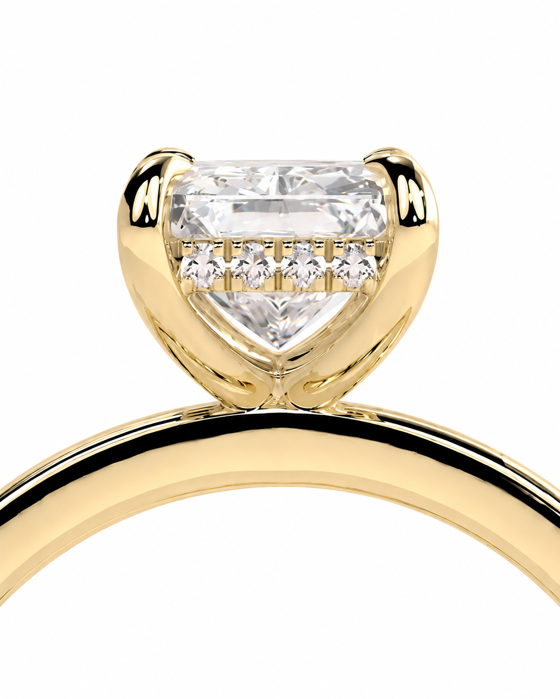 color_10K_YG, color_14K_YG &&A close-up of a yellow gold solitaire engagement ring featuring a heart-shaped clear gemstone in a prong setting, with a row of small accent diamonds along the top, set against a plain white background.