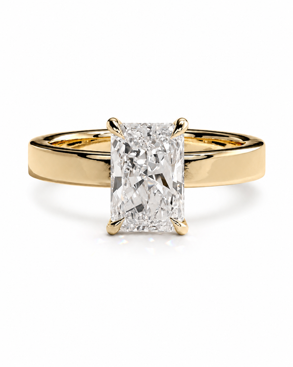 color_10K_YG, color_14K_YG &&A yellow gold solitaire engagement ring featuring a large rectangular radiant-cut diamond center stone in a four-prong setting, shown on a clean white background.