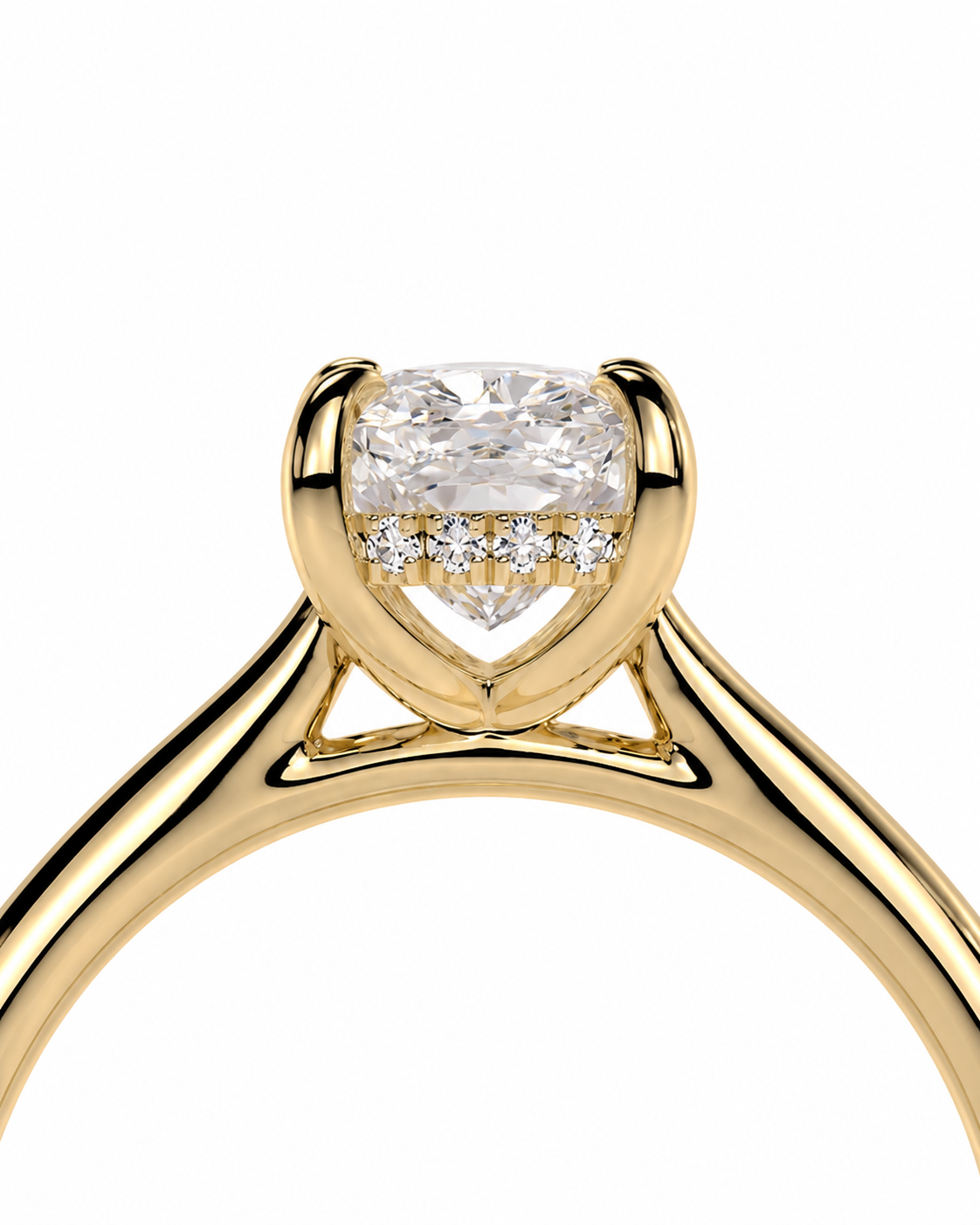 color_10K_YG, color_14K_YG &&A close-up of a yellow gold solitaire engagement ring featuring a cushion-cut diamond center stone and a row of small pavé diamonds on the band, set against a plain white background.