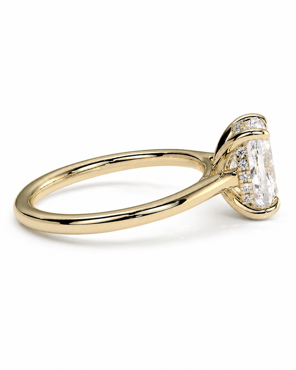 color_10K_YG, color_14K_YG &&A yellow gold solitaire engagement ring featuring a large rectangular clear gemstone in a prong setting, with smaller accent stones along the band, shown on a clean white background.