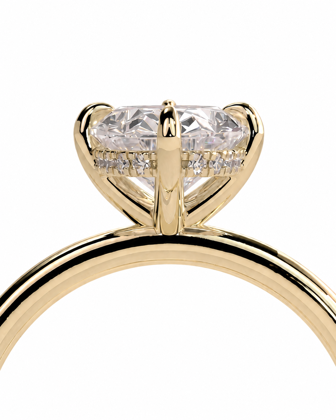 color_10K_YG, color_14K_YG &&A close-up of a yellow gold solitaire engagement ring featuring a large oval-cut clear gemstone in a four-prong setting, with small accent diamonds along the band, shown against a plain white background.
