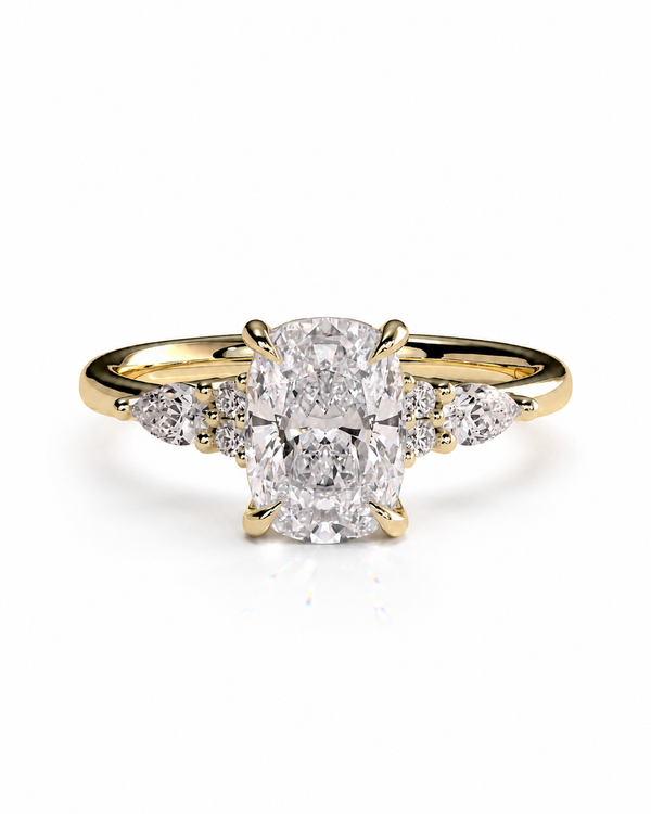 color_10K_YG, color_14K_YG &&A yellow gold engagement ring featuring a large oval center diamond flanked by smaller round and marquise-cut diamonds on the shoulders, set against a clean white background.