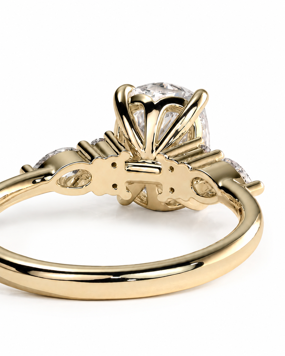 color_10K_YG, color_14K_YG &&A close-up shot of a yellow gold ring with a large clear round-cut center stone and smaller side stones, shown on a plain white background.