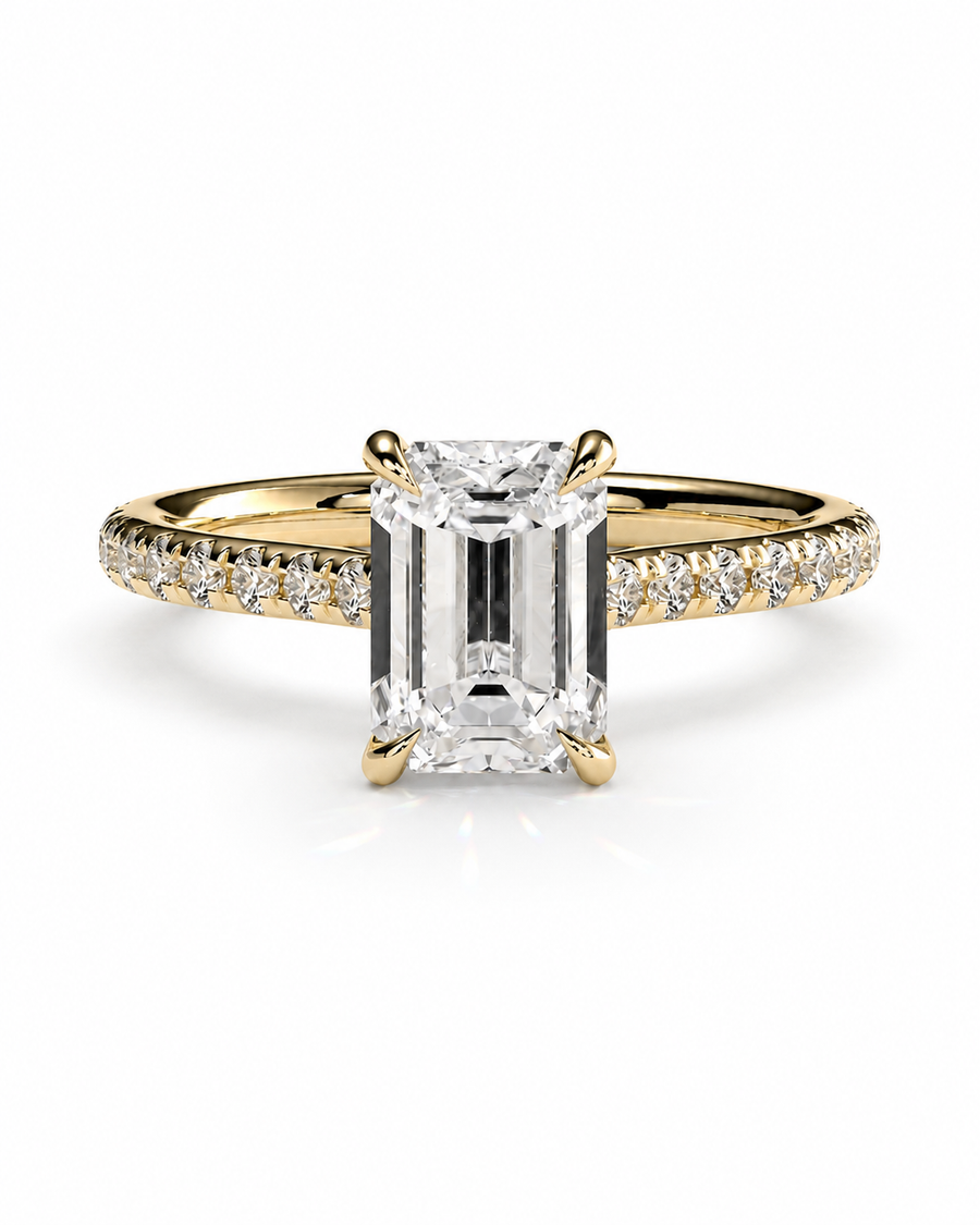color_10K_YG, color_14K_YG &&A yellow gold engagement ring featuring a large emerald-cut diamond center stone and a pavé-set diamond halo along the band, shown on a clean white background.