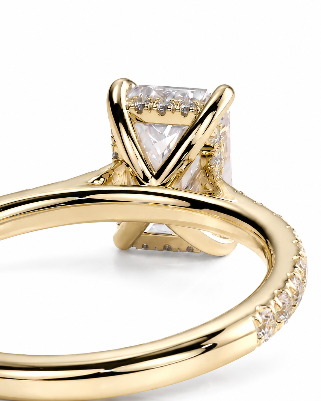 color_10K_YG, color_14K_YG &&A close-up shot of a yellow gold ring featuring a triangular clear gemstone in a prong setting, with small pavé accents along the band, on a white background.