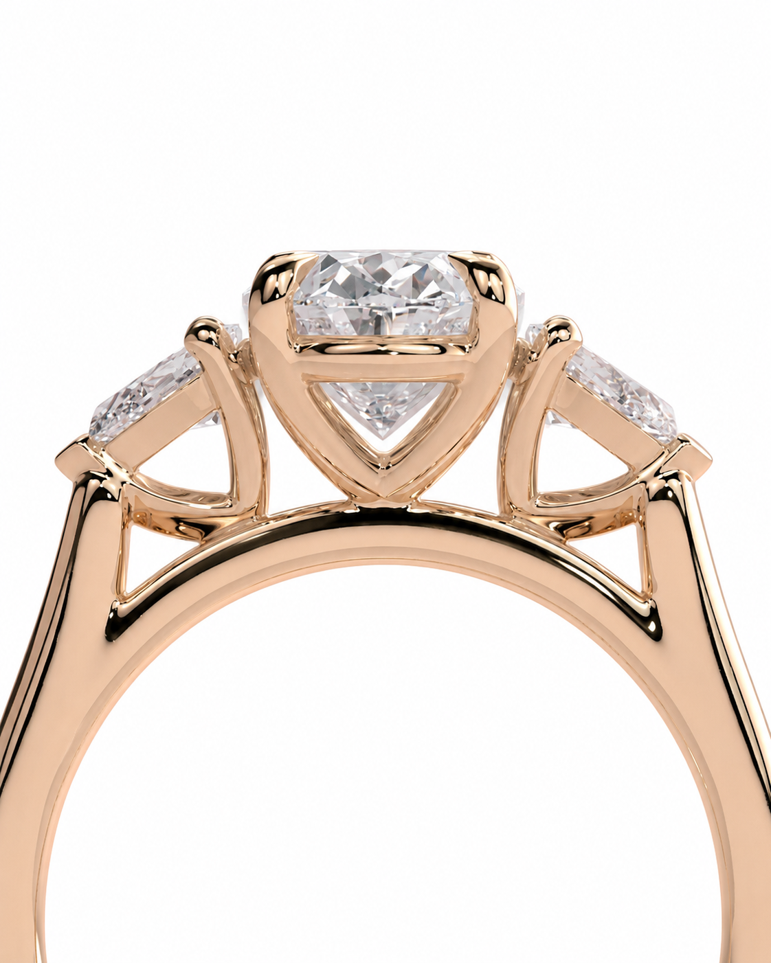 color_10K_RG, color_14K_RG &&
A close-up of a rose gold ring featuring a central princess-cut diamond and two smaller diamonds on either side, set against a plain white background.