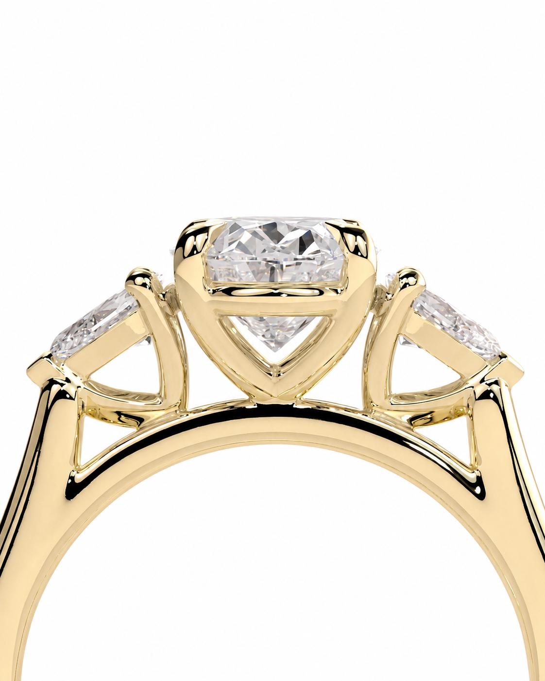 color_10K_YG, color_14K_YG &&
A close-up of a yellow gold ring setting featuring a central round brilliant-cut diamond, flanked by two smaller baguette-cut diamonds, on a plain white background.