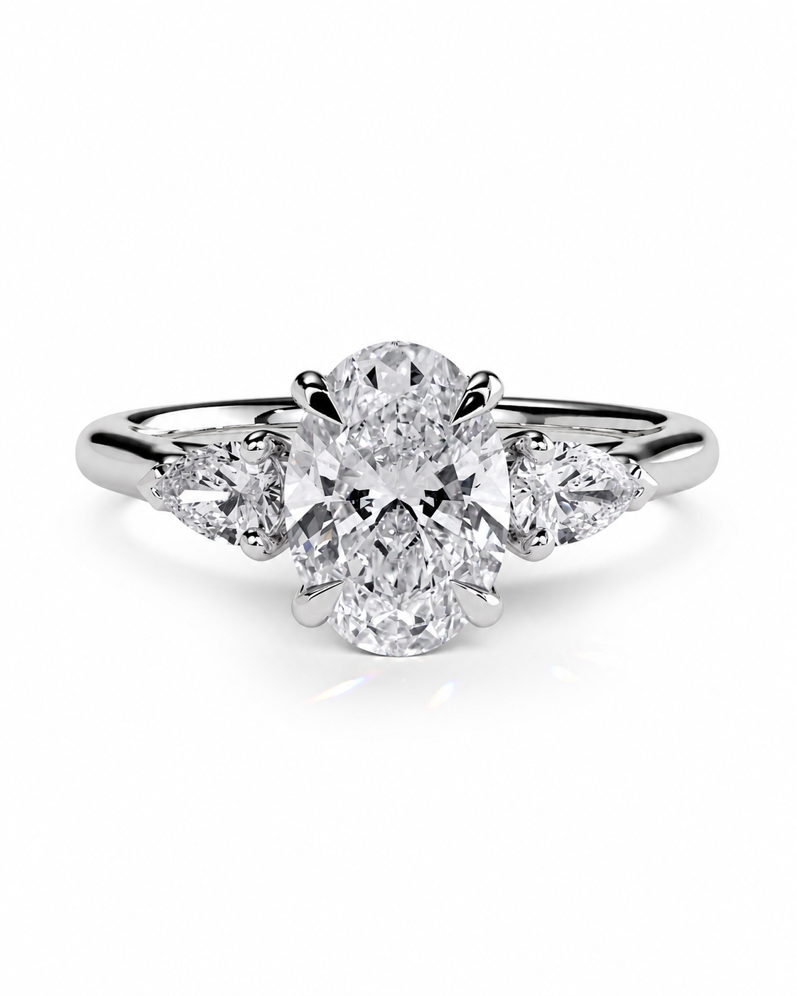 color_925_SIL,color_935_ARG,color_10K_WG, color_14K_WG &&
A radiant cluster diamond ring featuring a central oval diamond flanked by three marquise-cut diamonds on a polished silver-colored band, set against a clean white background.