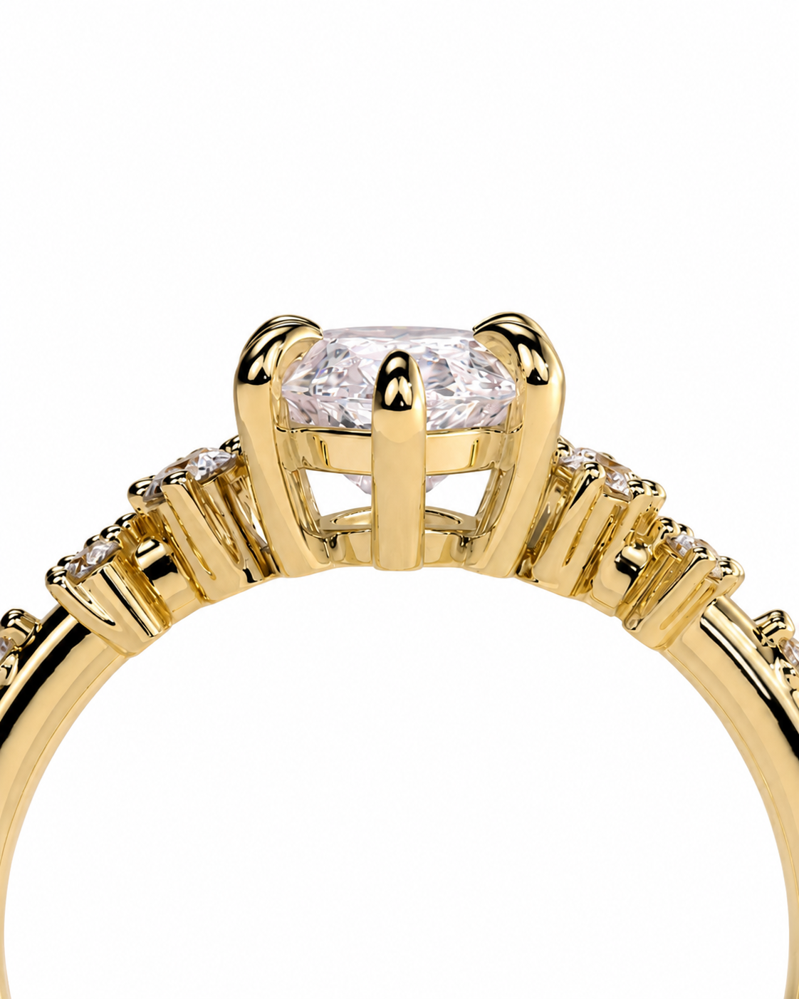 color_10K_YG, color_14K_YG &&A close-up shot of a yellow gold ring featuring a round brilliant-cut center stone and small pavé-set diamonds along the band, set against a plain white background.