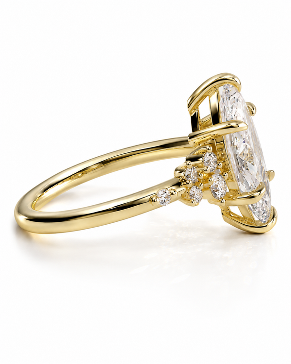 color_10K_YG, color_14K_YG &&A yellow gold ring featuring a large marquise-cut diamond center stone with smaller round and baguette diamonds set along the band, shown on a clean white background.