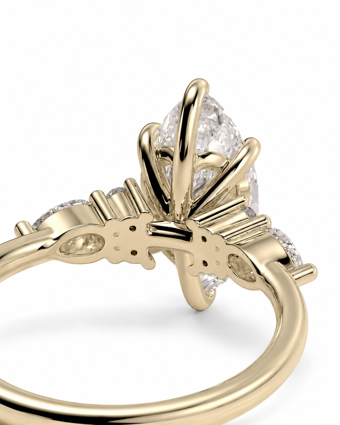 color_10K_YG, color_14K_YG &&Close-up of a yellow gold ring with a marquise-cut clear center stone and smaller side stones, shown on a white background.