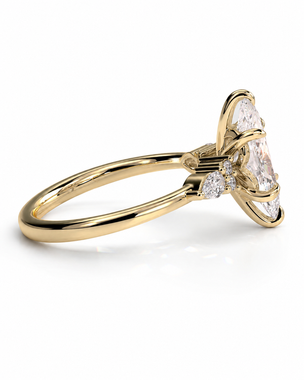 color_10K_YG, color_14K_YG &&A yellow gold ring featuring a large marquise-cut clear center stone with smaller round stones on the shoulders, shown on a clean white background.
