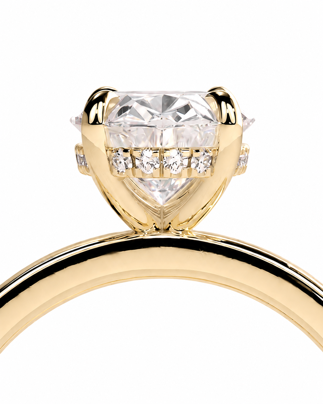 color_10K_YG, color_14K_YG &&A close-up of a yellow gold ring featuring a large heart-shaped clear gemstone in a prong setting, accented by small round diamonds along the band, on a plain white background.