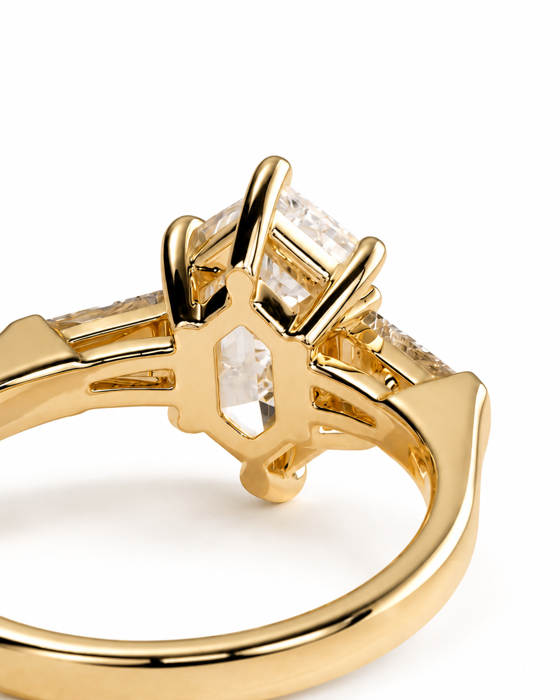 color_10K_YG, color_14K_YG &&A close-up shot of a yellow gold ring featuring a multi-stone setting with clear rectangular and marquise-cut gemstones, shown on a plain white background.
