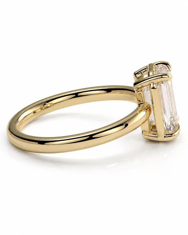 color_10K_YG, color_14K_YG &&A yellow gold ring with a large rectangular clear baguette-cut gemstone in a prong setting, shown on a clean white background.