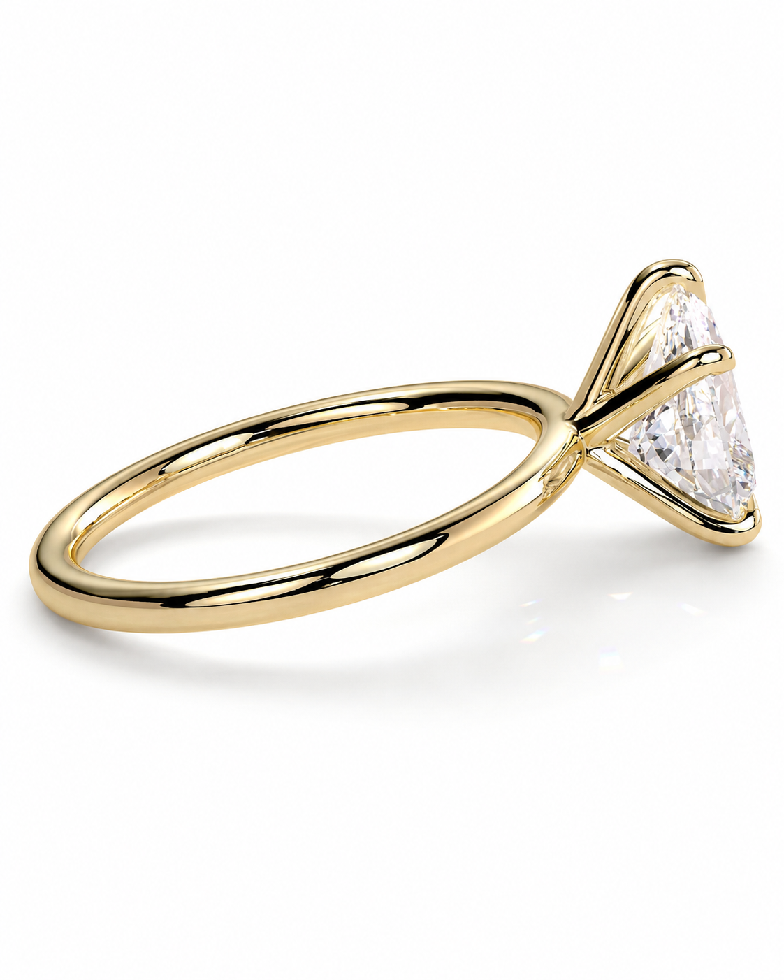 color_10K_YG, color_14K_YG &&
A yellow gold solitaire engagement ring featuring a triangular-cut clear gemstone in a prong setting, shown on a clean white background.