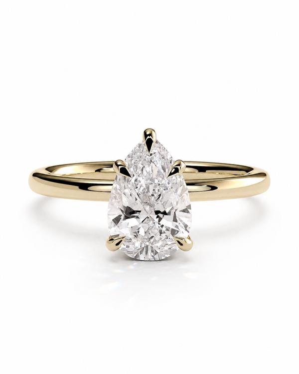 color_10K_YG, color_14K_YG &&
A pear-cut diamond engagement ring with a yellow gold band, shown on a clean white background.