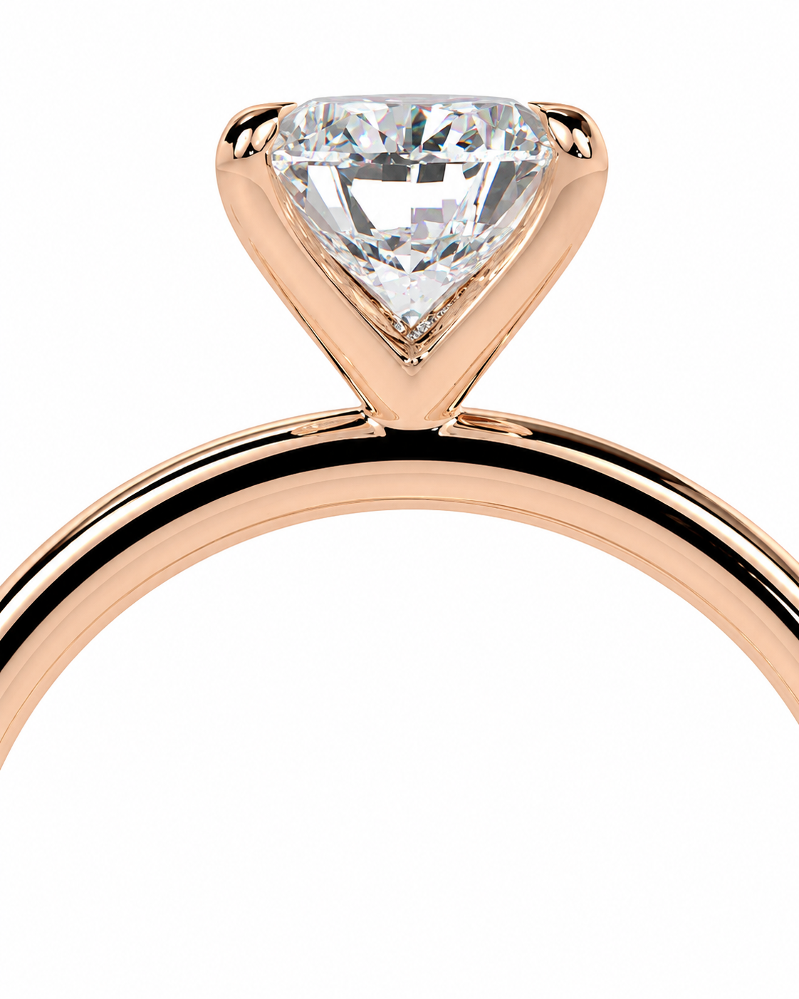 color_10K_RG, color_14K_RG &&
A close-up of a rose gold solitaire engagement ring featuring a brilliant triangular-cut clear gemstone in a four-prong setting, shown against a solid white background.