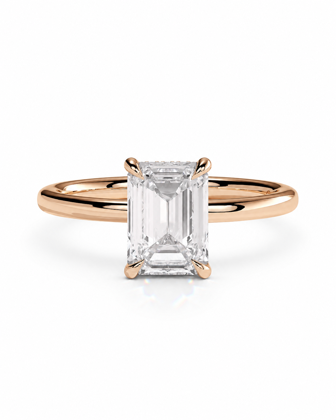 color_10K_RG, color_14K_RG &&
An emerald-cut diamond solitaire ring in a rose gold setting, centered on a clean white background.