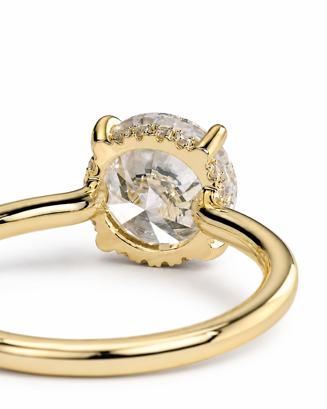 color_10K_YG, color_14K_YG &&A close-up shot of a gold ring featuring a large round clear gemstone in a prong setting, accented by small surrounding diamonds, on a clean white background.